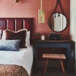 Hotel bed, side table and mirror
